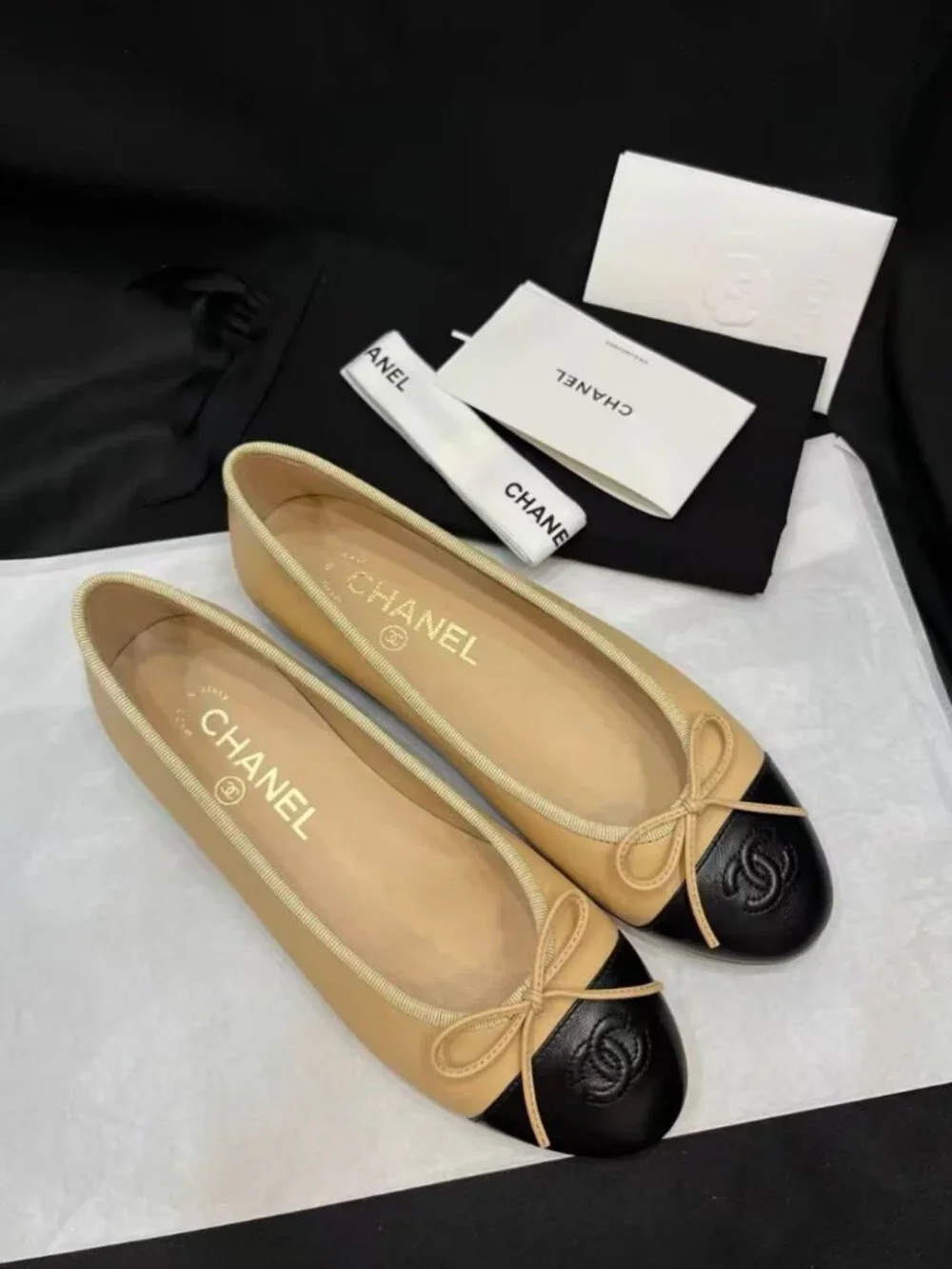 CHANEL Two‑Tone Bow‑Trim Leather Round‑Toe Ballet Flats